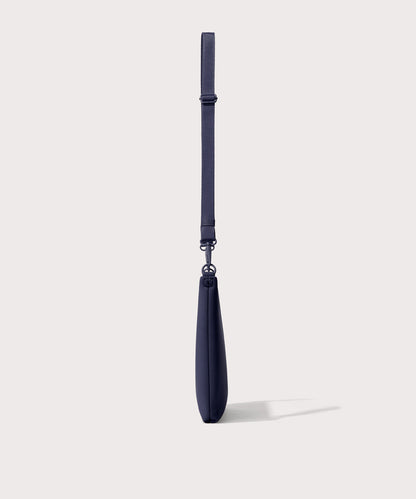 14 inch laptop shoulder bag in navy blue seen from the side view .