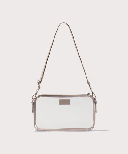 Clear crossbody bag with a beige strap on a white background. Stadium compliant.