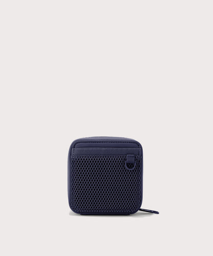 Dagne Dover small Arlo Tech Organizer in dark blue seen from the back.