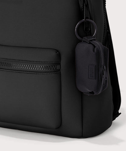 Dagne Dover Hunter Keychain in black clipped onto a backpack.