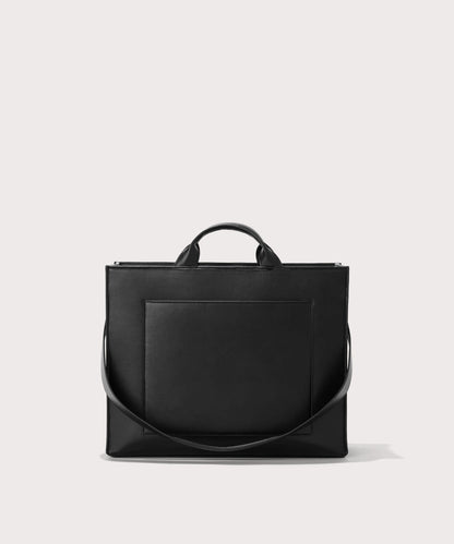 Dagne Dover medium vegan Daily Tote in black with the 11" shoulder strap